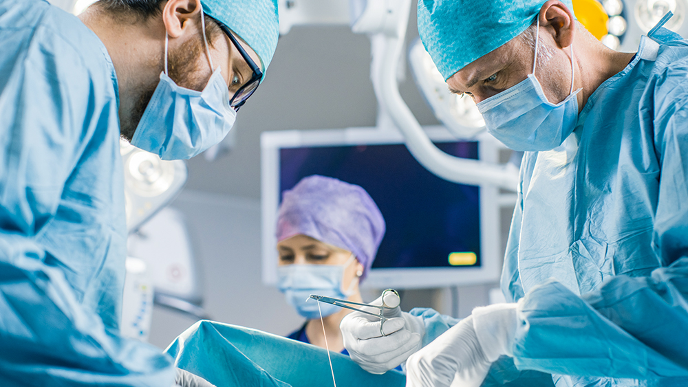 Health care professionals work in the operating room