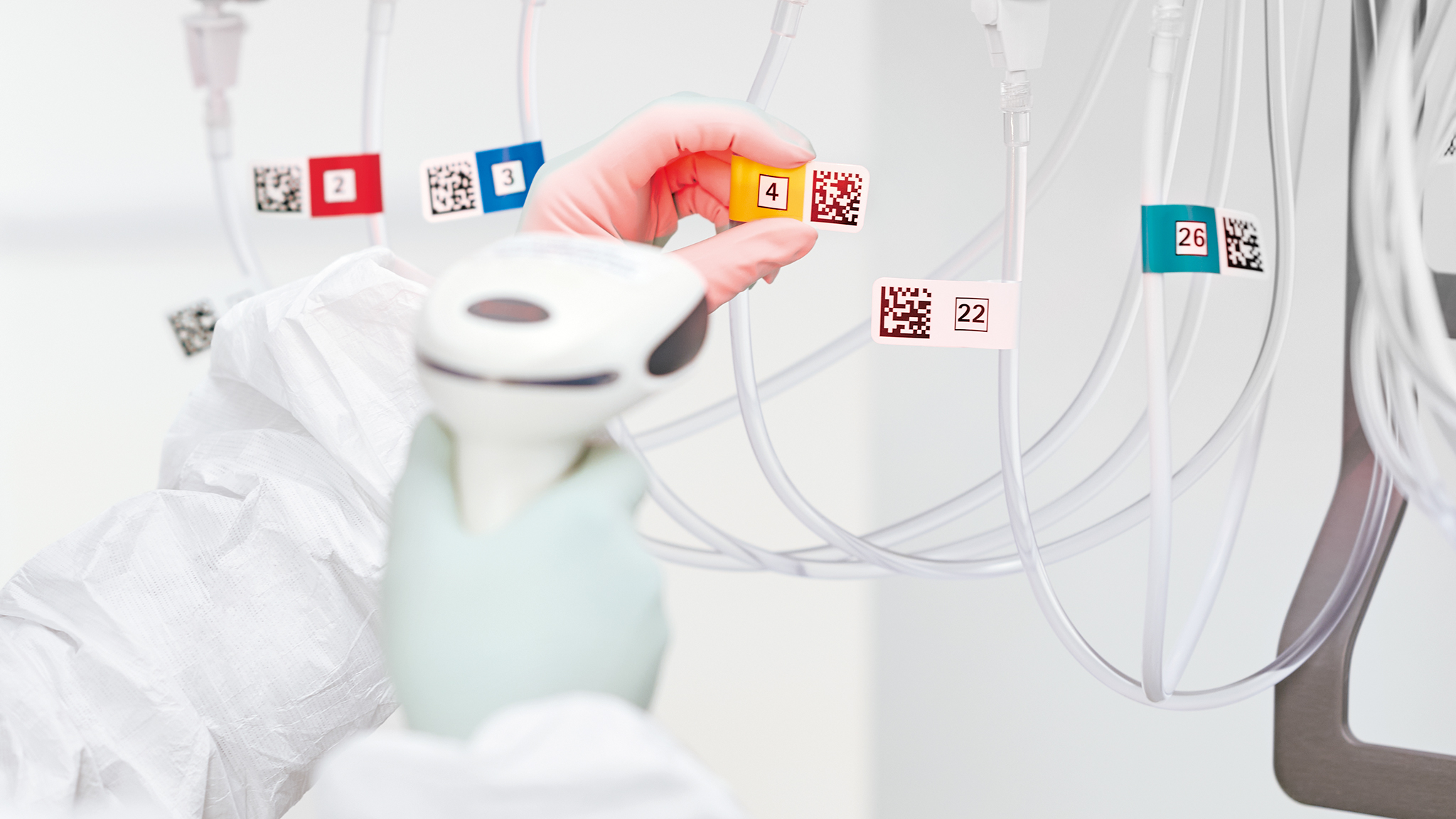 Hands of a medical worker scanning a QR code