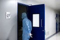 Entering a sterile room using a sterile outfit.