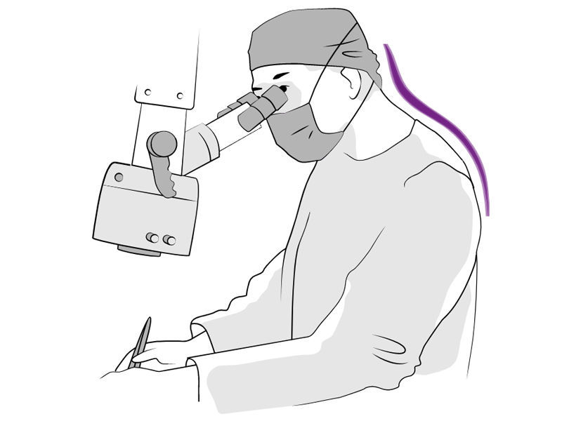  A healthcare professional, fully dressed in medical attire, using a microscope