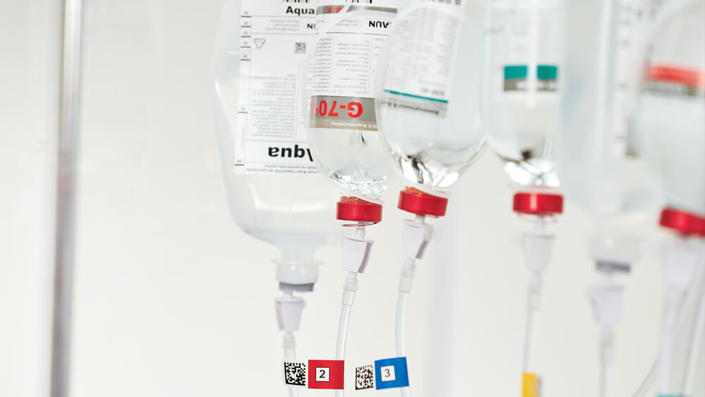 Bottles with different prepared medications connected to the tubes