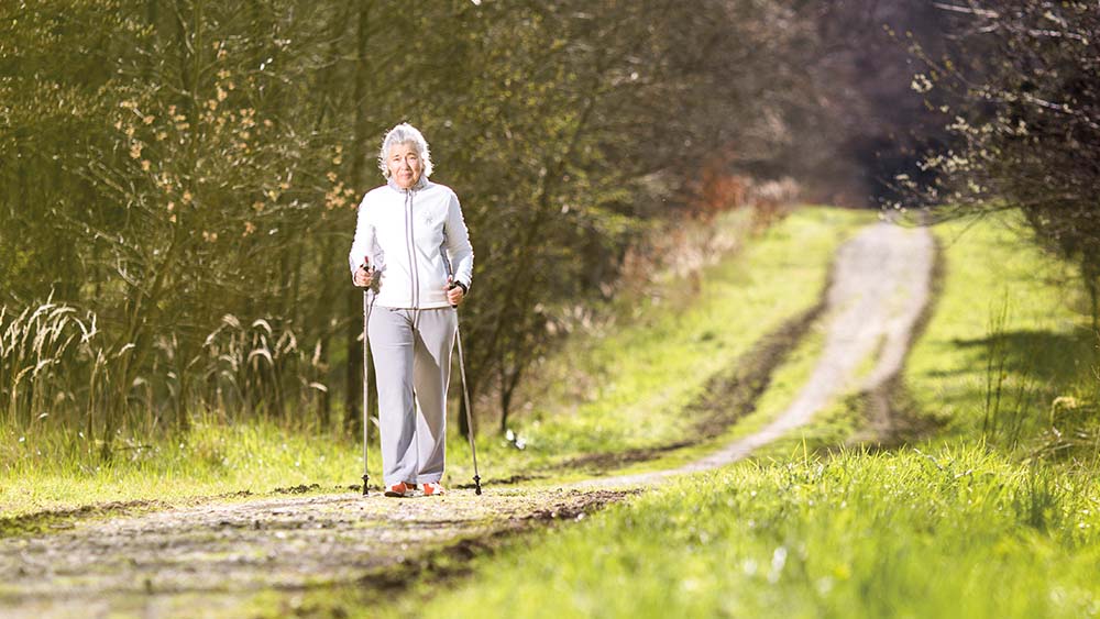 dialysis-patient-elderly-woman-in-nature-doing-nordic-walking.jpg