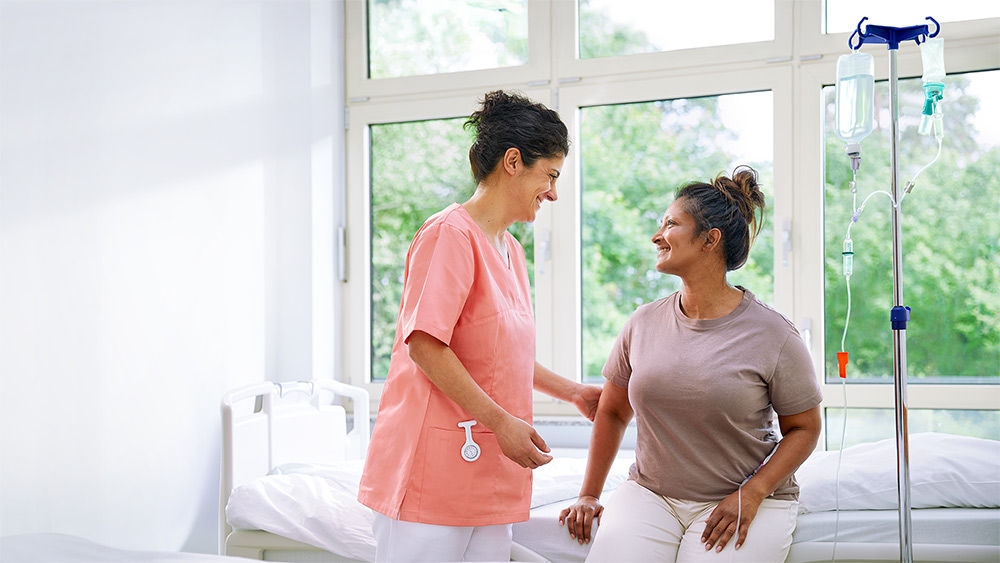 Nurse and patient with an intrafix safeset flush.