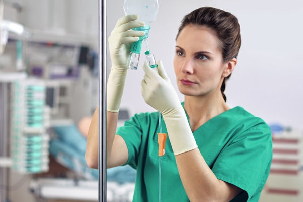 nurse checks intrafix safeset flush