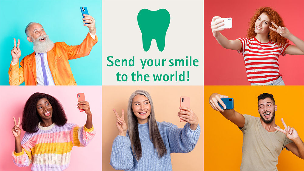 Our slogan for IDS “Send your smile to the world!” is illustrated by 5 different people putting their fingers up in a V shape.
