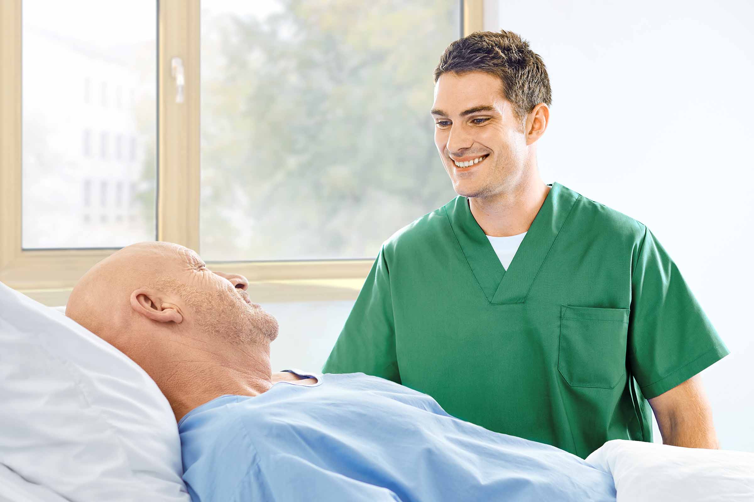 nurse and patient talking at the bedside