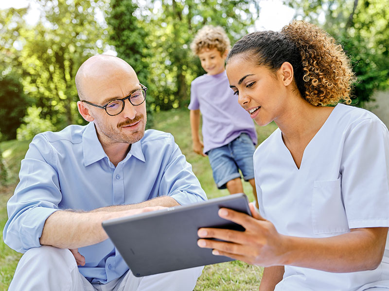 Modern renal care center building with horizontal metal slats on the facade and the B. Braun logo partially visible.