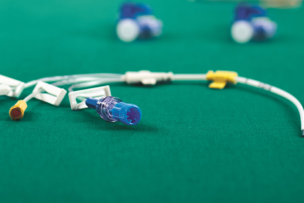 Certofix® central venous catheter is lying on a sterile green underground