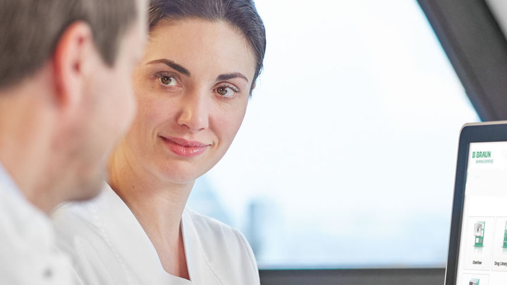 Two healthcare professionals are talking with each other