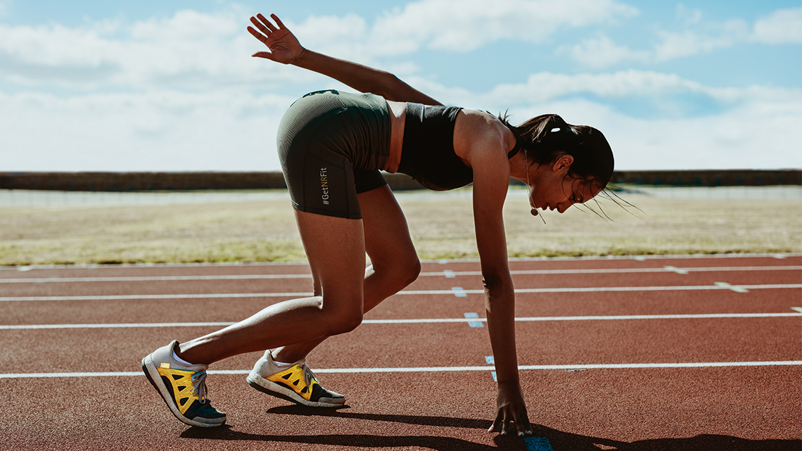 Female racer in starting position