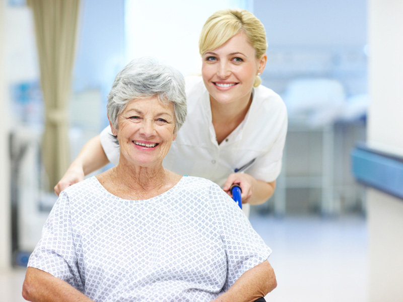 Female patient with a nurse laughing together