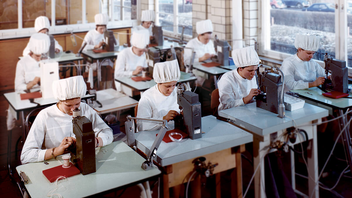 A vintage picture of B. Braun production worker skillfully operating production machine to create medical device